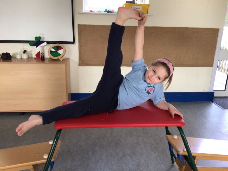 child posing for gymnastics